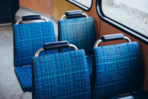 istock Blue passenger chairs in public bus. Vacant subway wagon with free seats. 2193707972