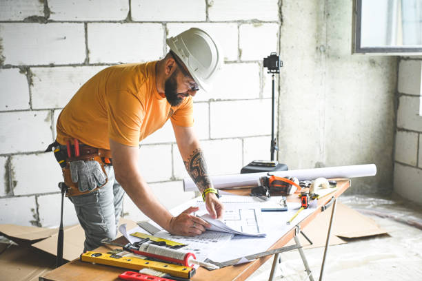 istock worker doing renovations in an apartment 2193709069