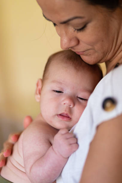 istock Loving mother hugging newborn at home 2193711511