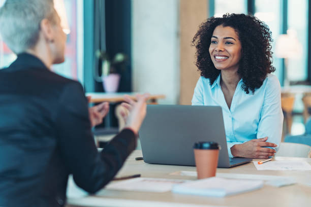istock Businesswomen talking across the table 2193712293