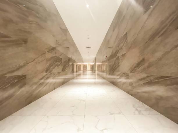 Hotel corridors, reflective stone, warm lighting, symmetrical image