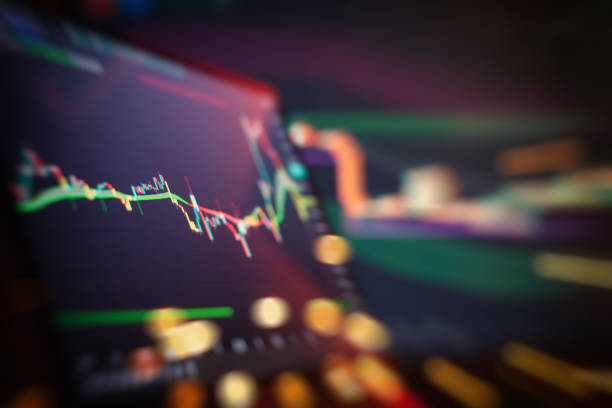 istock Abstract financial trading interface with dynamic stock market candlestick chart and blurry light effects 2193713676