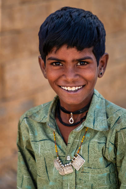 istock Young Indian boy in desert village, India 2193714475