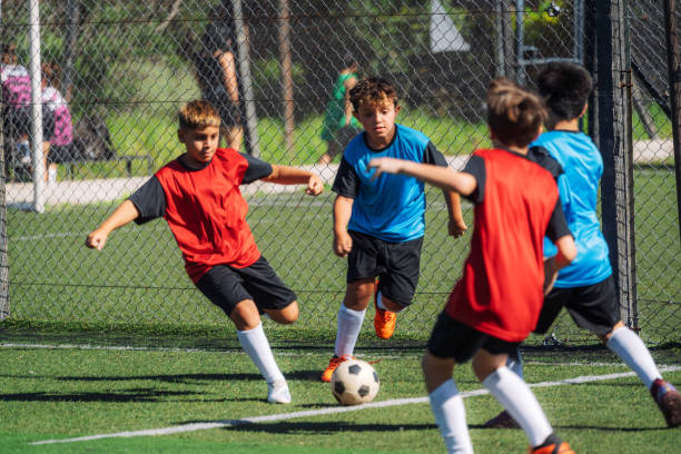 istock Children Playing Soccer on a Field During a Competitive Match 2193715297