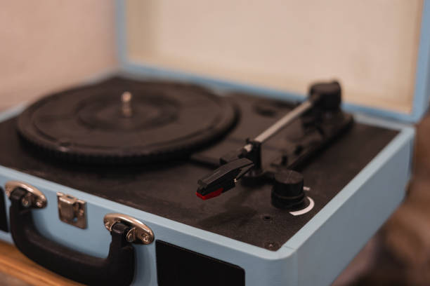 istock Close up of a vintage record player sitting on a table in a music studio. 2193721934