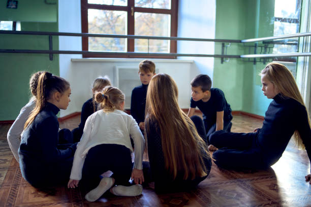 istock a group of pre-teens perform a teacher's task during an acting class, communication in a circle 2193724935