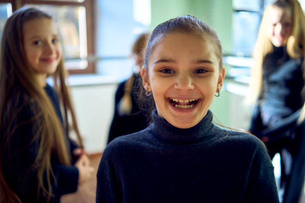 group of pre-teens perform a teacher's task during an acting class, detective game, investigation
