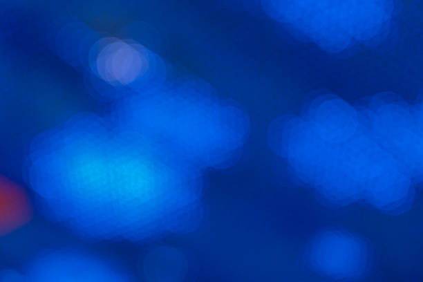 View on a blue abstract background with bokeh defocused lights. New Year, Christmas