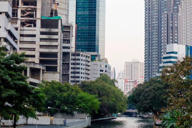 Bangkok skyline at Bunruang watergate canal in Lumphini, Pathum Wan. Seen to east from bridge at street Sukhumvit Soi 3 / Ratchadamri Rd