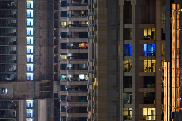 istock Close up illuminated skyscrapers at night 2193729996