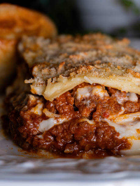 istock Homemade lasagna served on a rustic plate with a dark background 2193730150