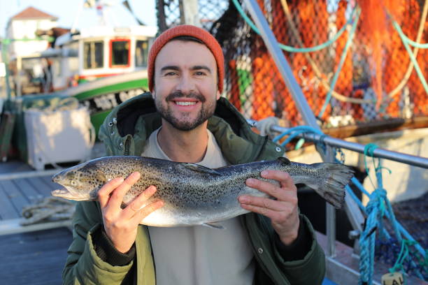 istock Fisherman showing a beautiful salmon 2193730790