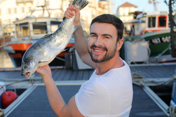 istock Fisherman showing a beautiful salmon 2193730830