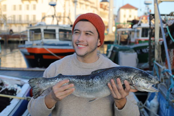 istock Fisherman showing a beautiful salmon 2193730847