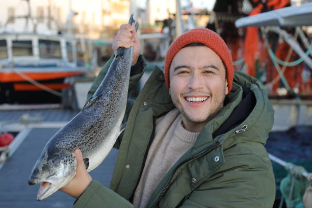 istock Fisherman showing a beautiful salmon 2193730886