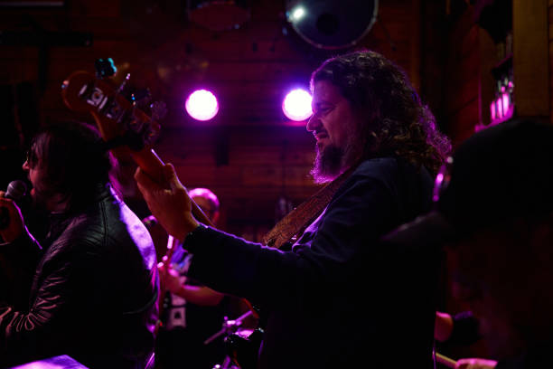 istock Heavy metal band performs electrifying set at late-night concert venue 2193731461