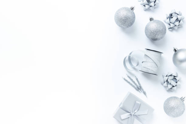 istock Frame of silver Christmas and New Year decorations on white background. Top view 2193732763