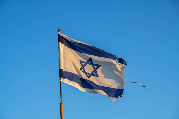 istock Israel's flag waving in the wind 2193732948