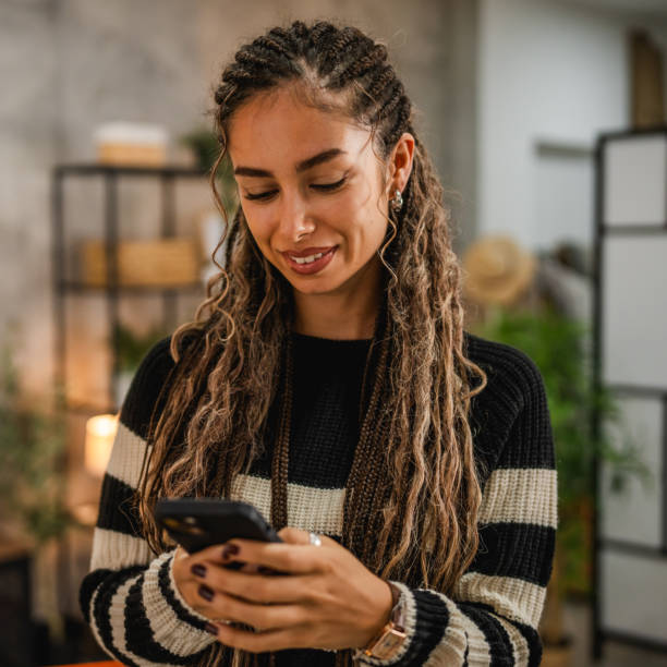 istock young smile woman use mobile phone at cozy home setting 2193732950