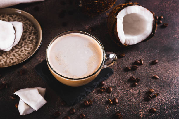 istock Cup of iced coconut coffee, coconut pulp and coffee beans on table 2193734190