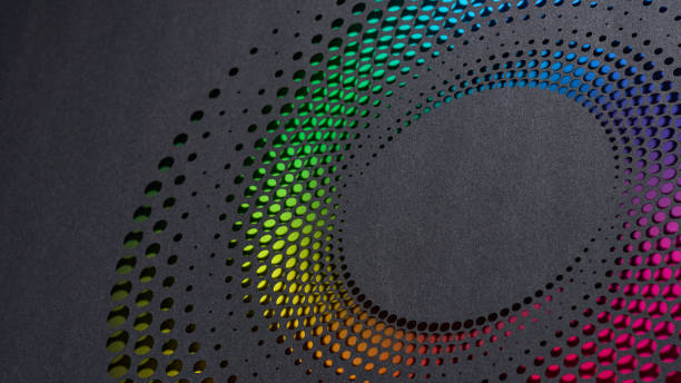 istock Colorful circular gradient pattern with rainbow hues, cut into textured dark paper for a modern design 2193736778
