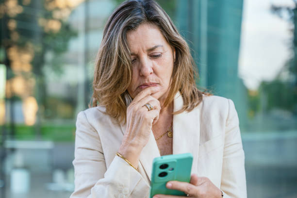 istock Confident businesswomanusing smartphone outdoors 2193737557