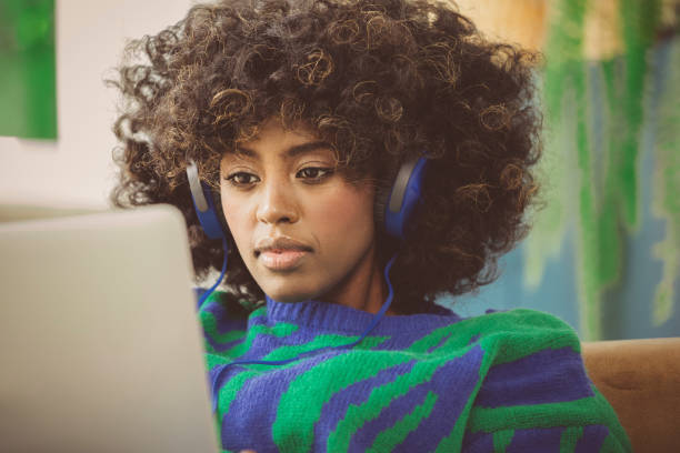 istock Young woman using laptop at home 2193738683