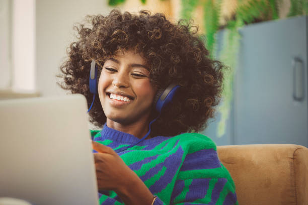 istock Young woman using laptop at home 2193738739