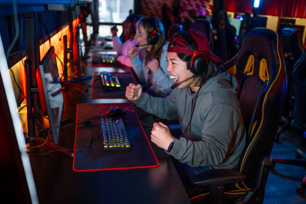 istock Young man celebrating his success after winning in video game 2193739760