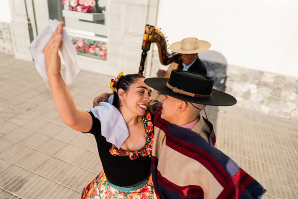 istock Couple dancing at a folkloric cueca event in Santiago, Chile 2193743351
