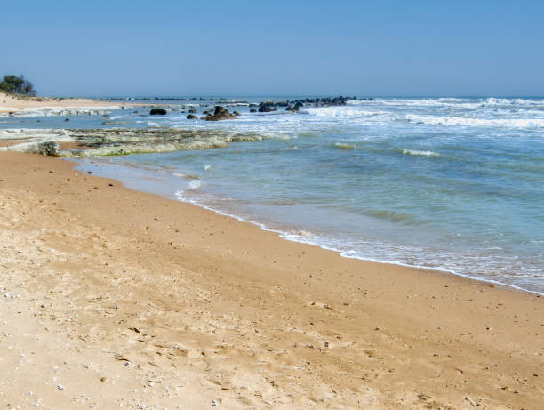 istock Sandy beach with small rocks . Sicily, Italy. 2193743779