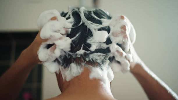 istock Man washing hair. 2193745126