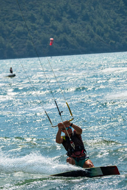 istock A man kitesurfing on a kiteboard. 2193747527