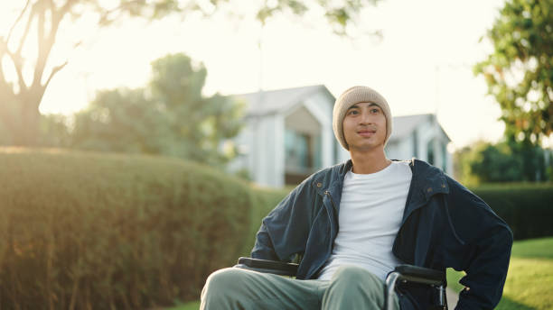 Man riding wheelchair.