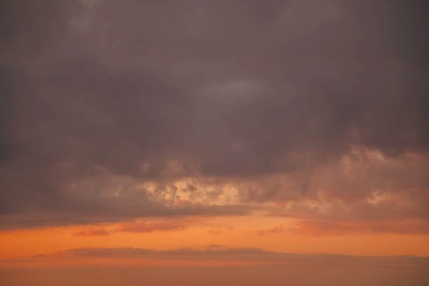 Backgrounds of colourful and beautiful sunset / sunrise with clouds with sunlight on dramatic sky texture