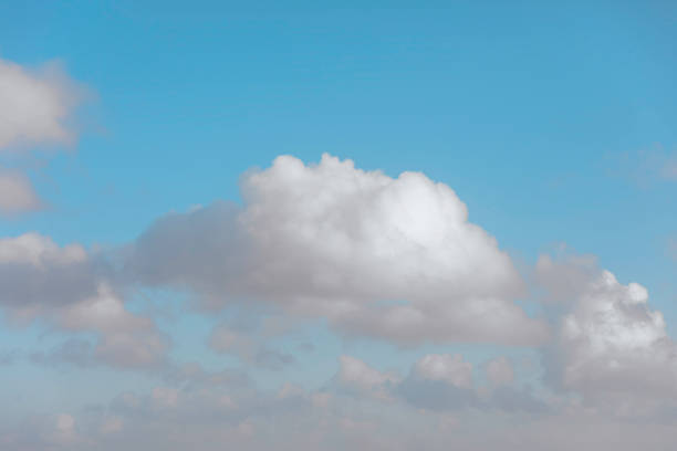 Nature background abstract photo of the beauty of the sky adorned with white, billowing cumulus clouds, creating an abstract texture against the vast expanse of bright blue. This panoramic view offers a captivating angle, showcasing the ethereal dance of clouds amidst the boundless sky. Immerse yourself in the tranquility of nature's canvas, where the interplay of light and shadow creates an ever-changing spectacle of wonder