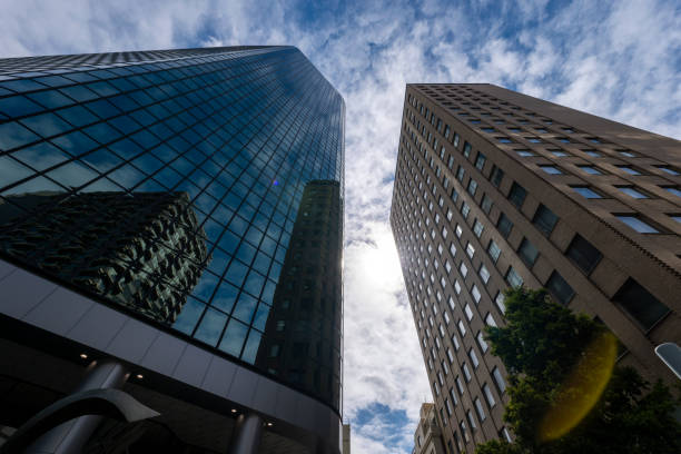 Close up views of Downtown Oakland's tallest buildings, including the Ordway building (right), and the Kaiser Center building (middle) with Lake Merritt in the foreground.