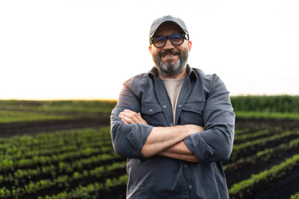 istock Portrait of a Smiling Farmer in Field During Sunset 2193755331