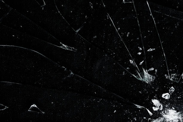 istock Broken hit glass with crack and particle overlay 2193758493