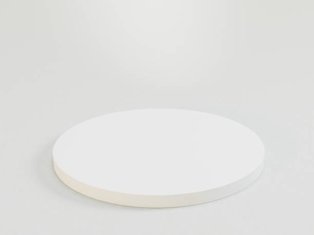 istock A white circular object with a foam or sponge-like center sits on a flat surface The outer border has a slight indent, and the background is uniformly white 3D empty podium 2193760289