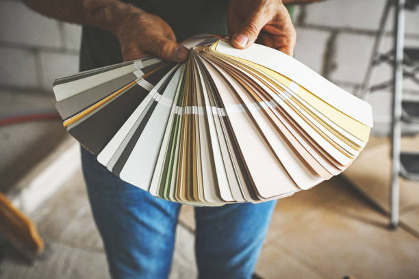 istock worker doing renovations in an apartment, Color Swatch, 2193770108
