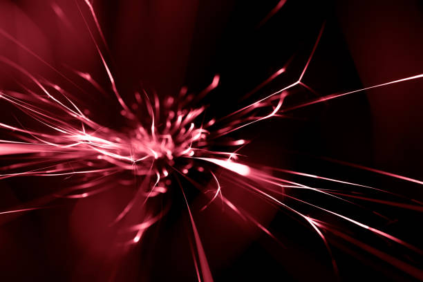 red sparks from the grinder glowing in the dark straight ahead