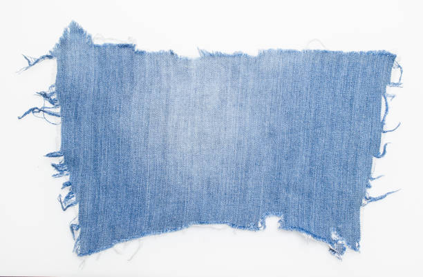 istock jeans. a frayed and torn piece of denim rag 2193771441
