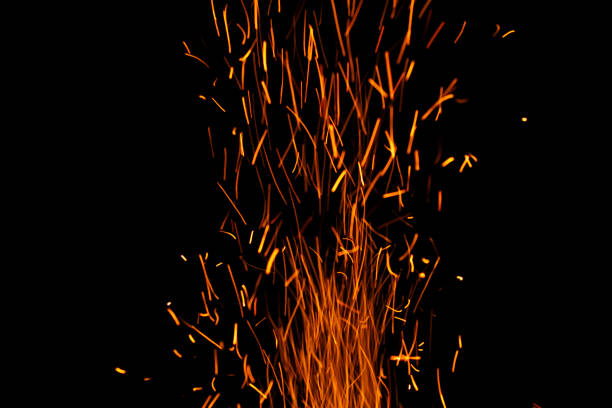 sparks from the fire glowing in the dark
