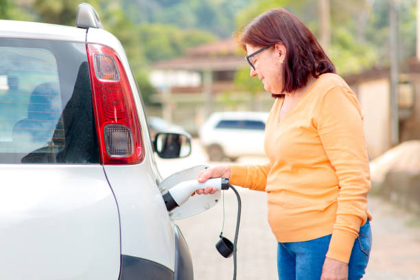 istock Charging an Electric Car Outdoors 2193776669