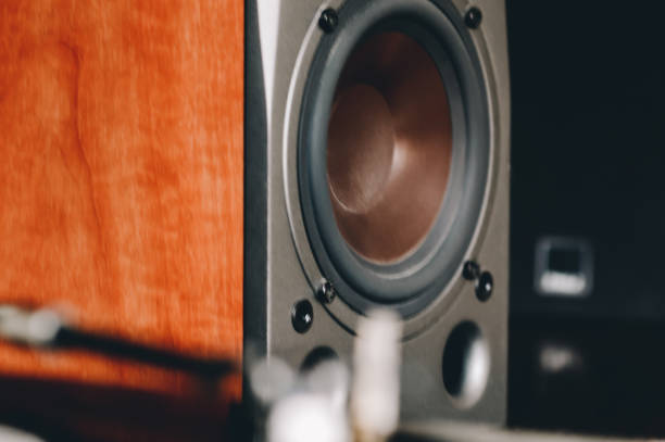 3d rendering of a large black stereo box with two round speakers on white background. Sound equipment. Home cinema. Audio appliances.