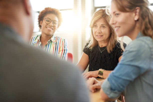 istock Unposed group of creative business people in an open concept office brainstorming their next project. 2193778206