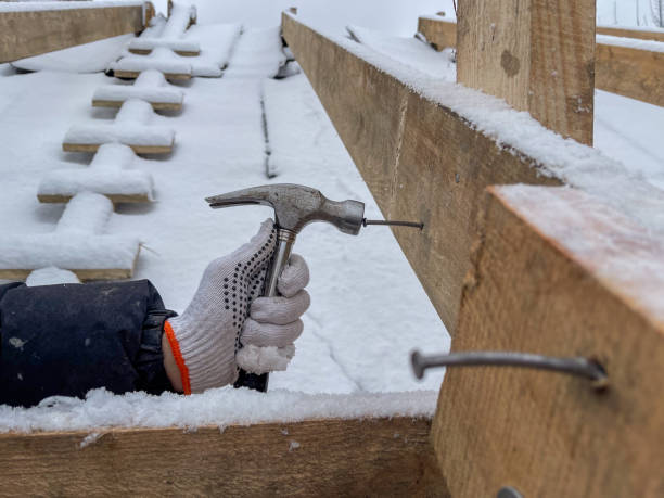istock A shot of hands hitting a nail with a hammer 2193779486