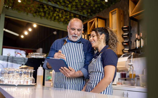istock Barista training a new employee at a cafe 2193787969