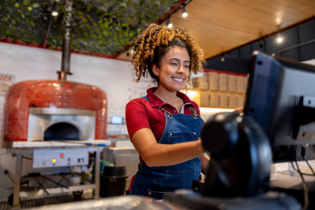 istock Waitress working at a pizzeria placing an order in the system 2193788053